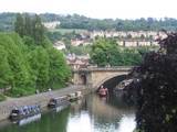 Terraced houses in Bath and the canal with longboats