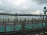 Smoggy view of boats at anchor in Hong Kong from the airport bus on the way into Kowloon